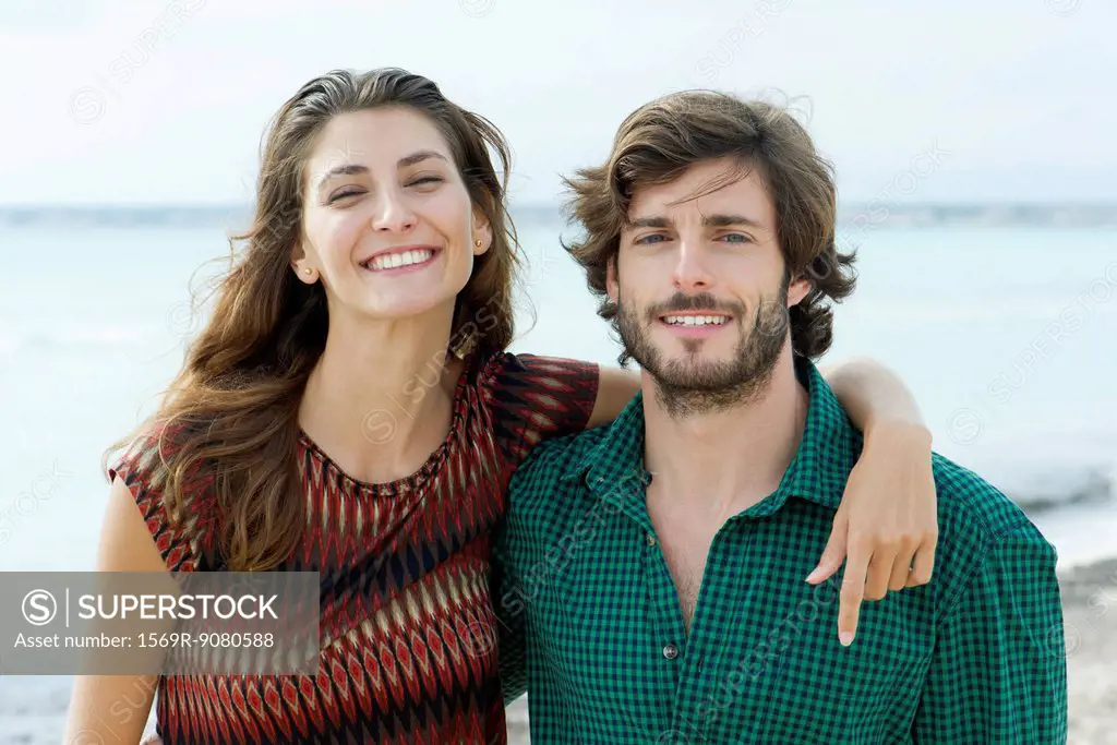 Young couple at the beach, portrait