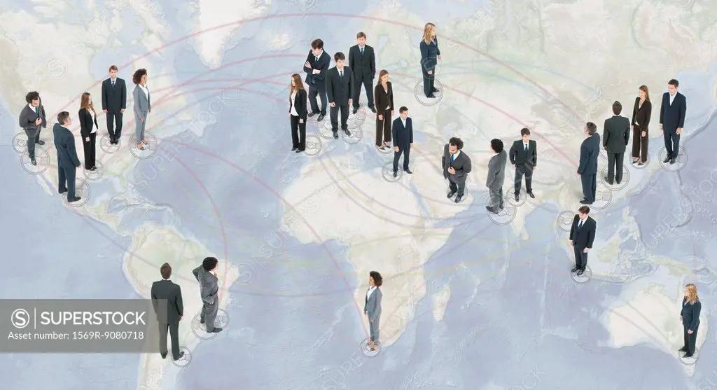 Large group of business people standing on world map