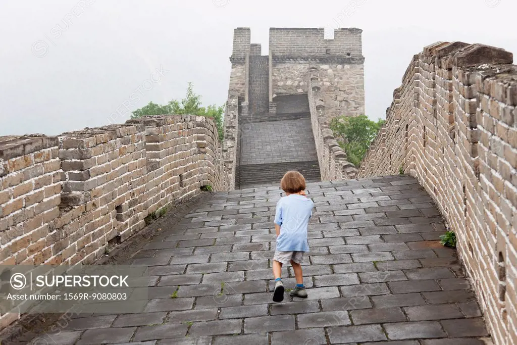 China, boy walking on Great Wall of China