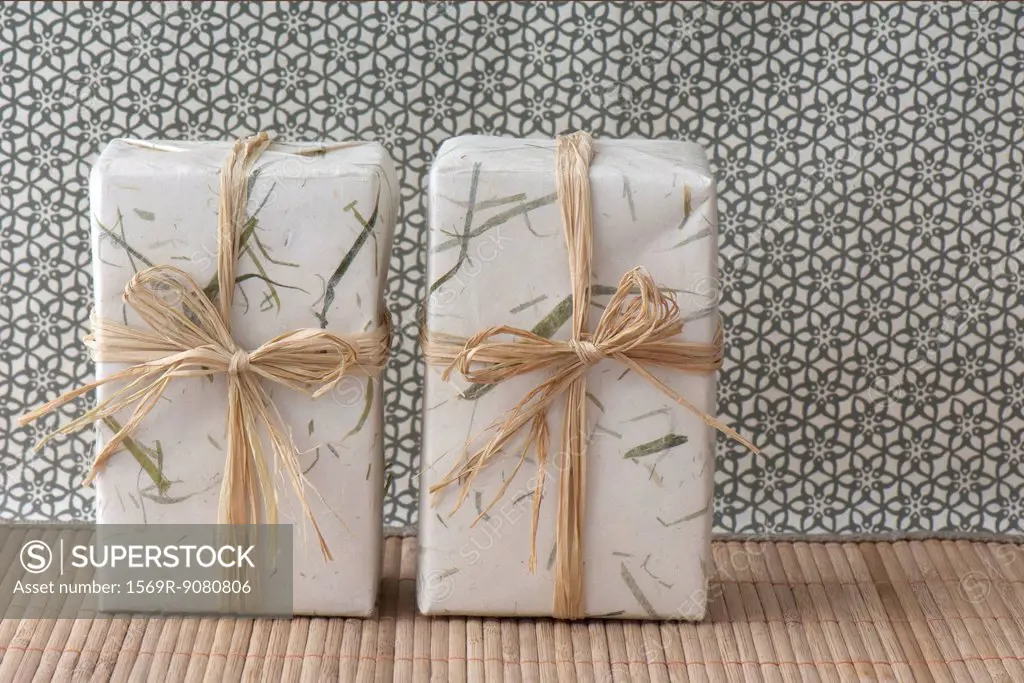 Gifts wrapped in paper and raffia