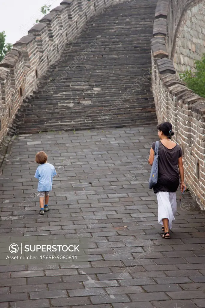 China, mother and son walking on Great Wall of China