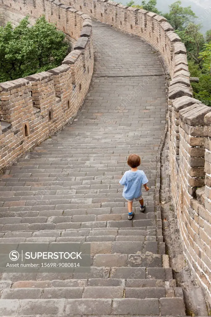 Boy walking on Great Wall of China, China