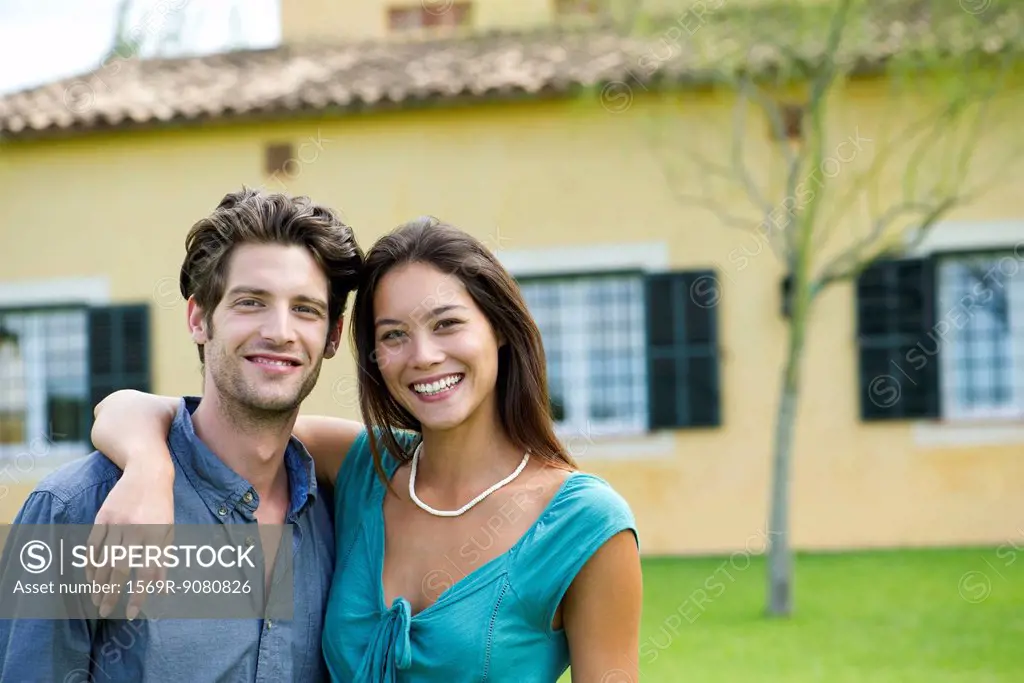 Young couple outdoors, portrait