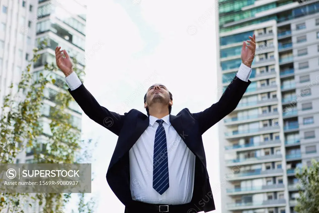 Businessman with arms outstretched