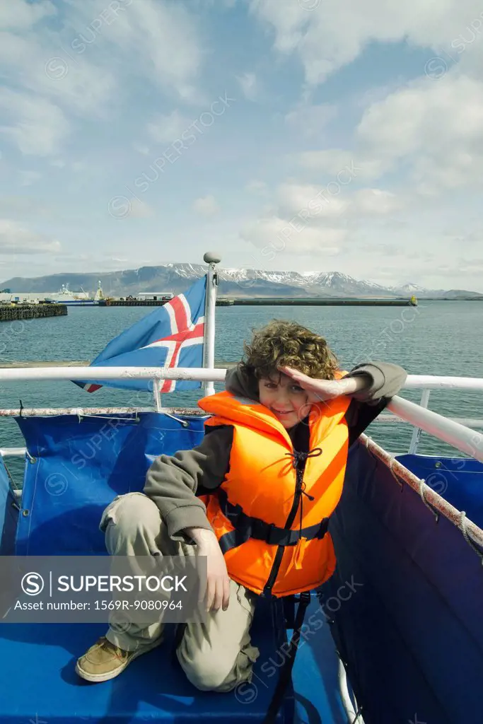Boy in a lifejacket on a boat, Reykjavik Iceland