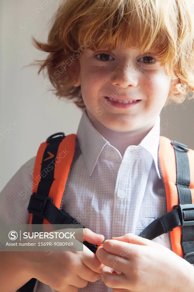 Boy wearing backpack, portrait