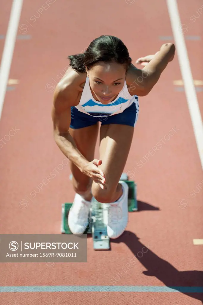Woman running at starting line