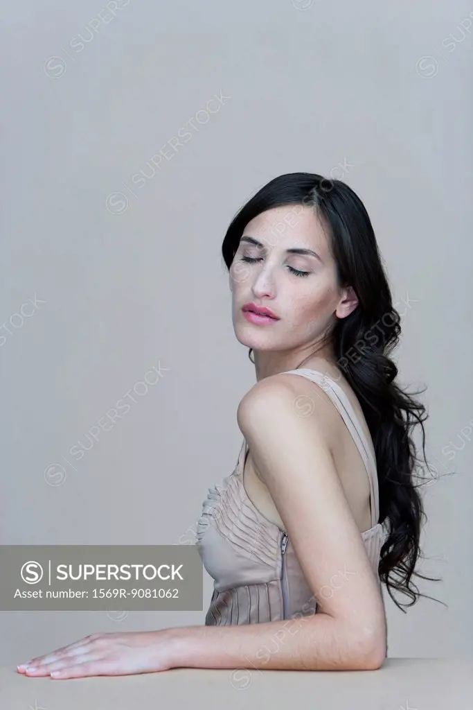 Young woman with eyes closed, portrait