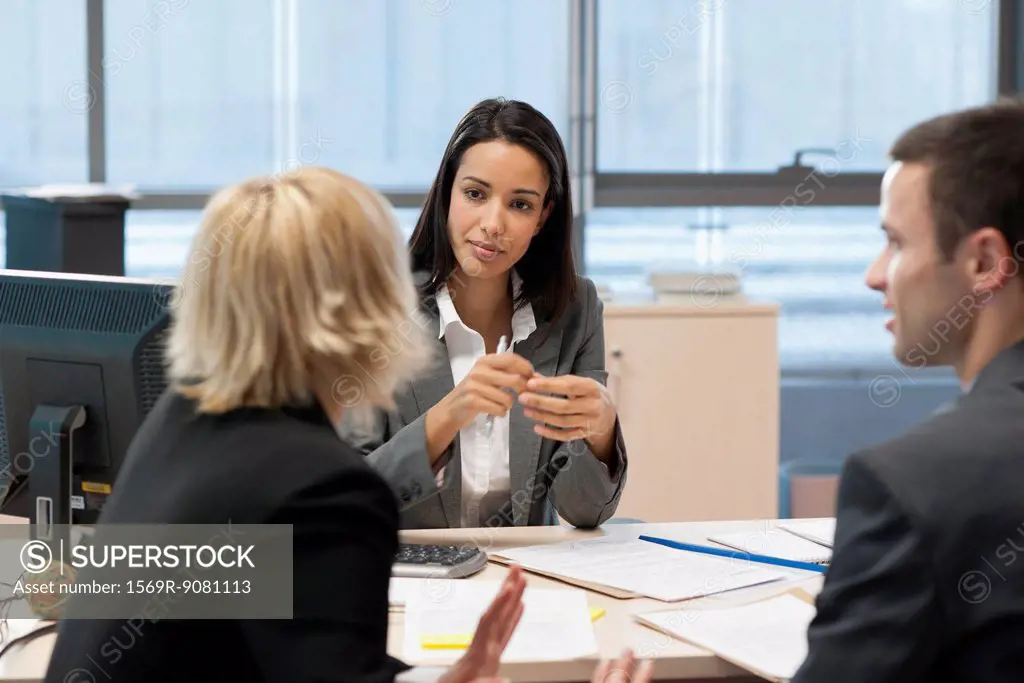 Businesswoman meeting with business partners in office