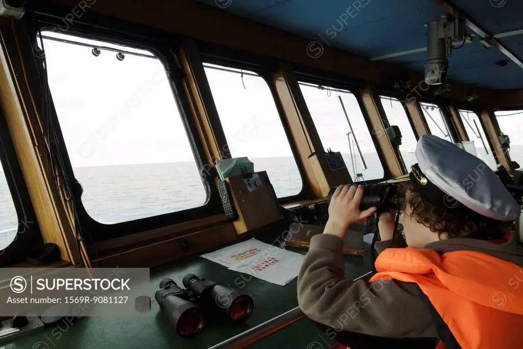 Boy playing captain, cockpit