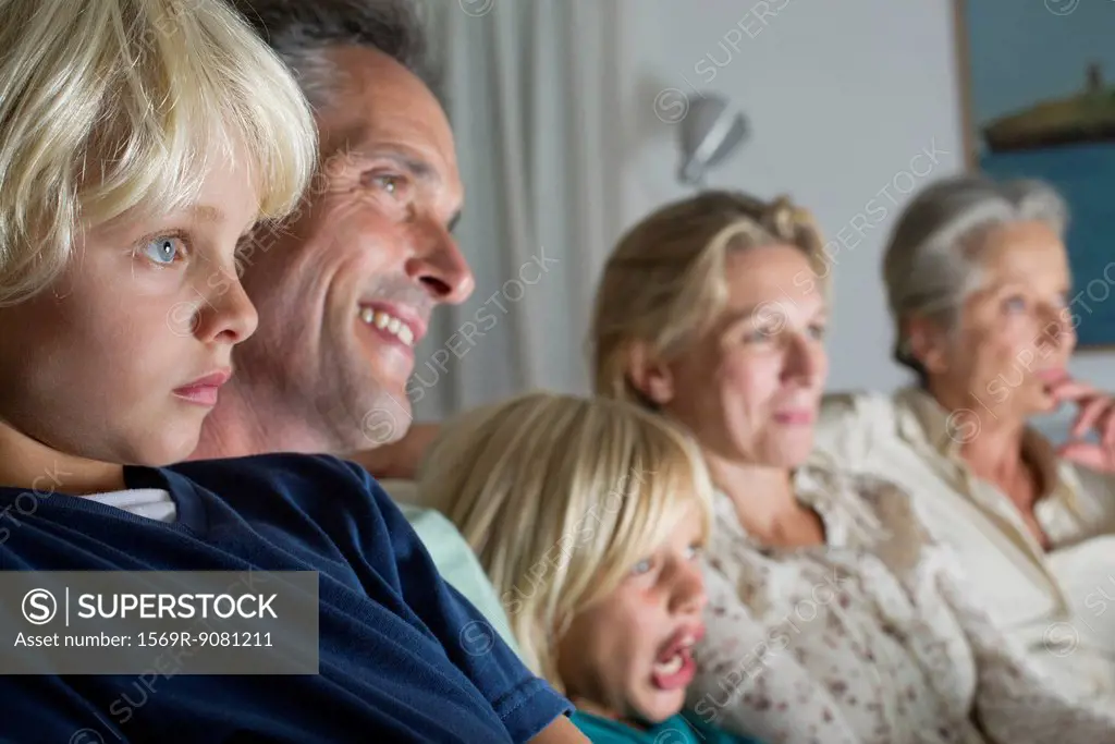 Family watching TV together
