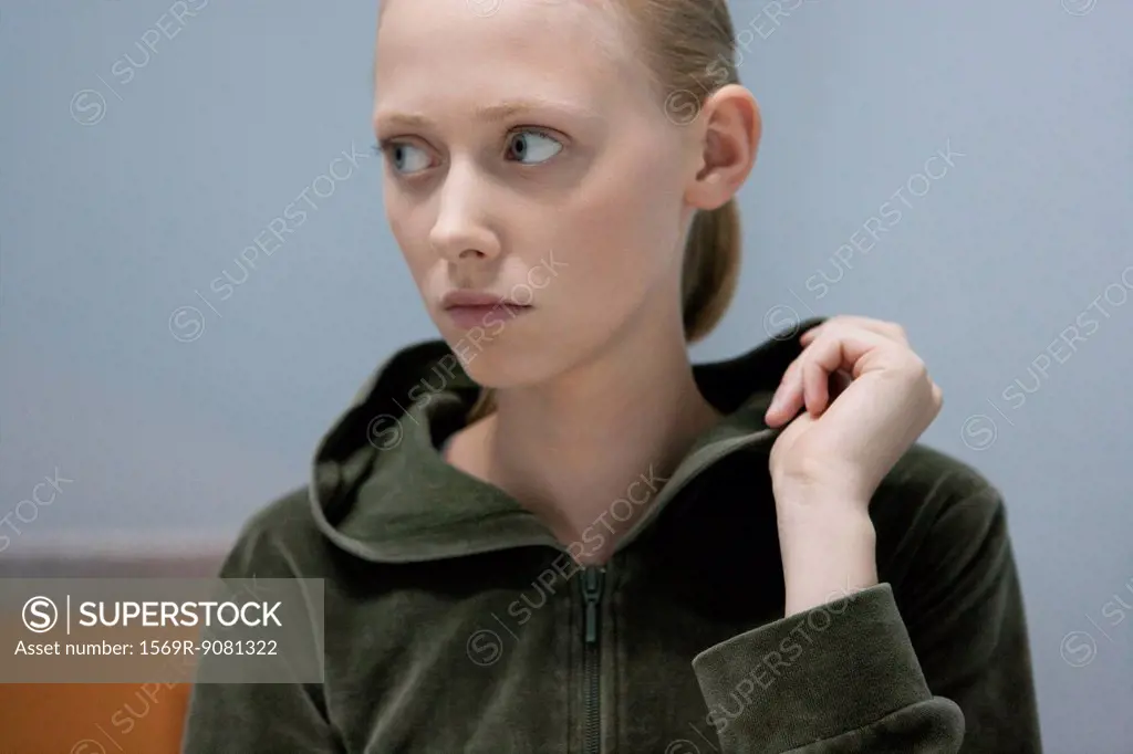 Young woman looking away, portrait