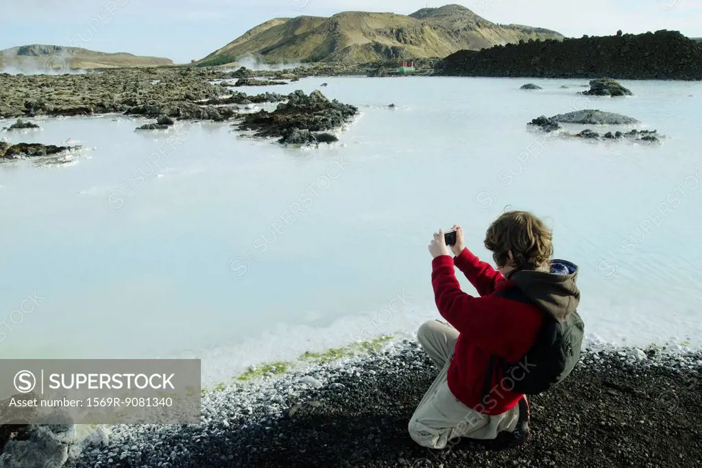 Boy photographing around the Blue Lagoon, Iceland