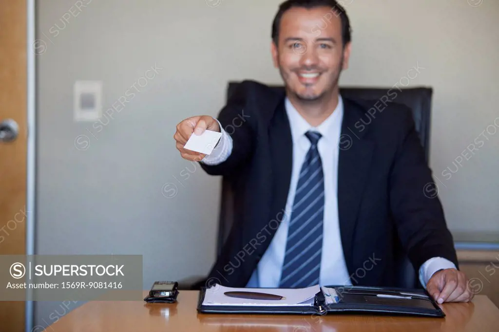 Businessman handing out business card