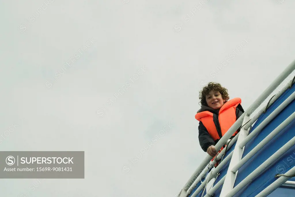 Boy in a lifejacket on a boat, Reykjavik Iceland