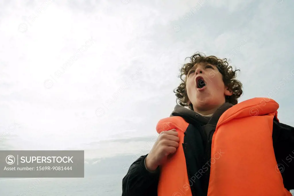Crying boy with life jacket