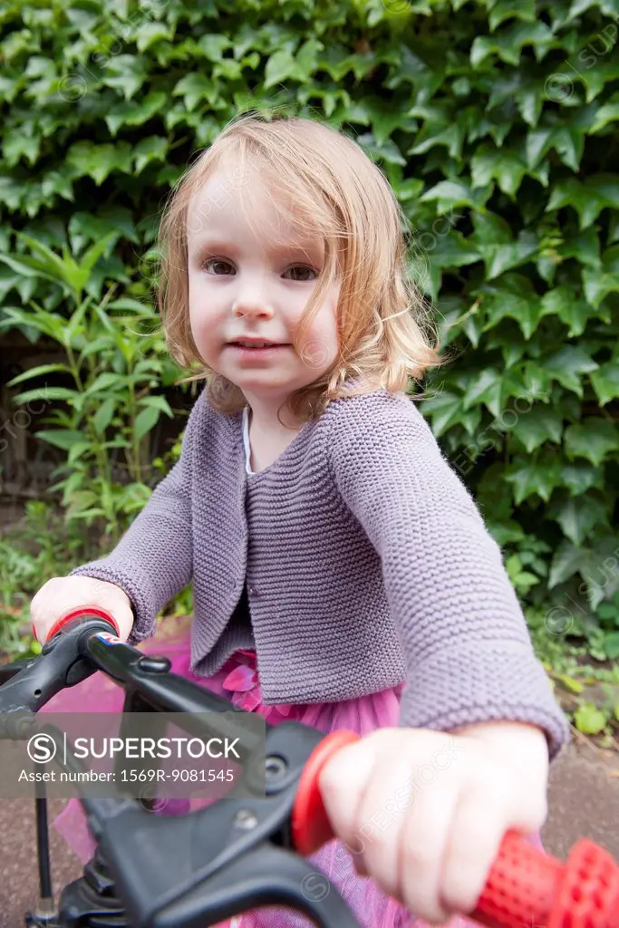 Little girl with bicycle, portrait