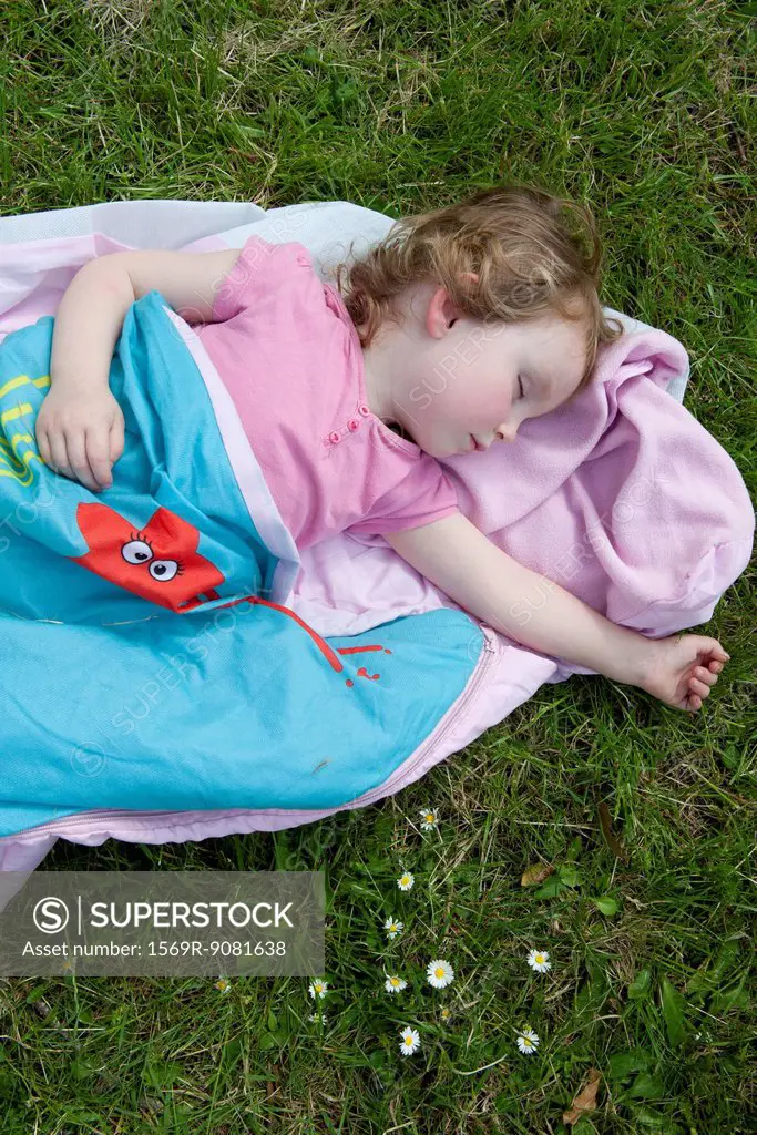 Little girl napping outdoors