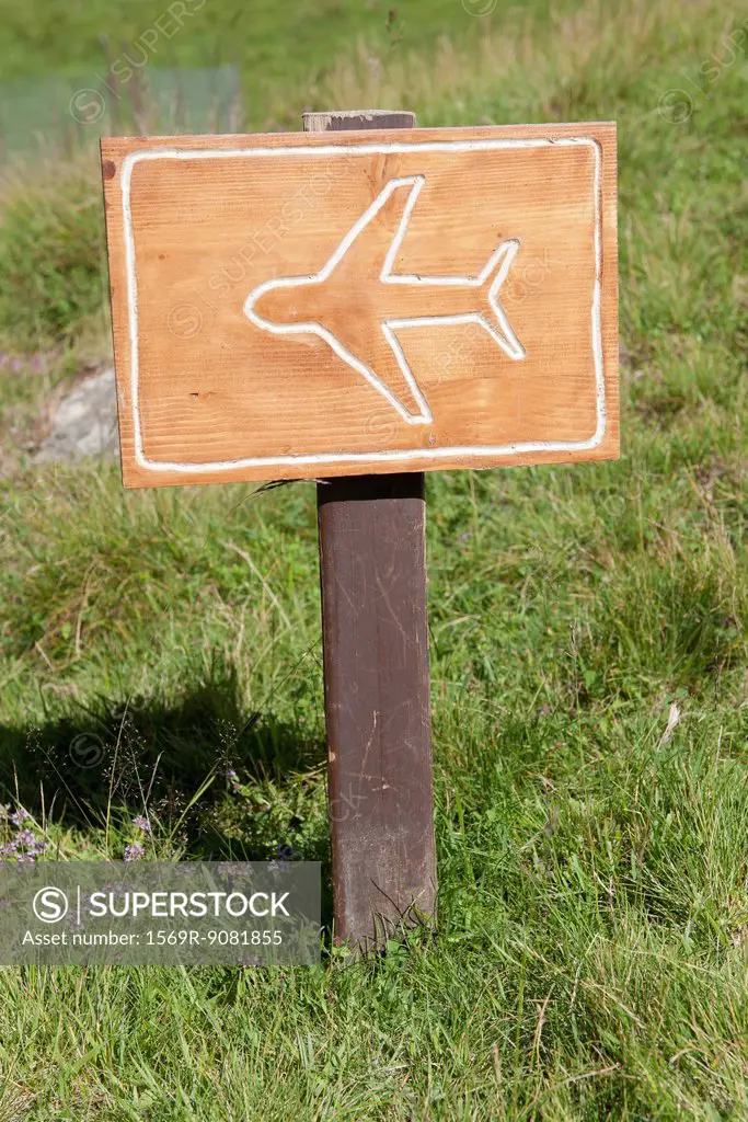 Wooden sign with symbol of air plane
