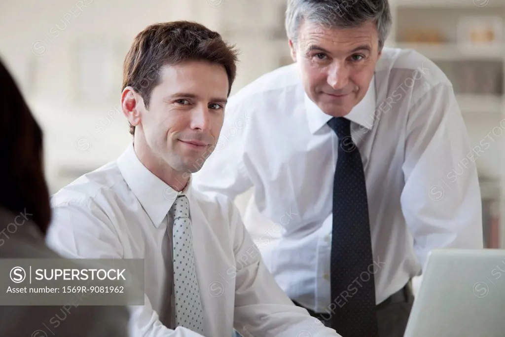 Businessmen working together, portrait