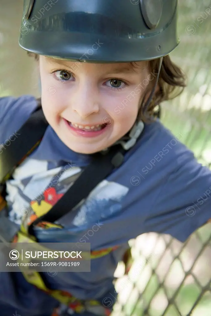 Boy wearing helmet, smiling