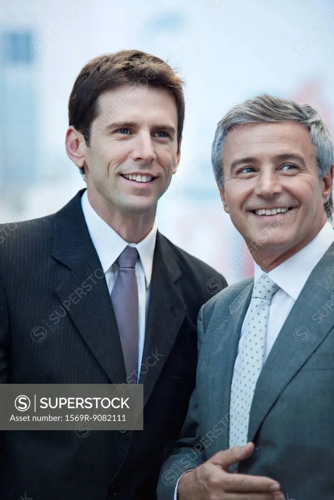 Businessmen together outdoors, portrait