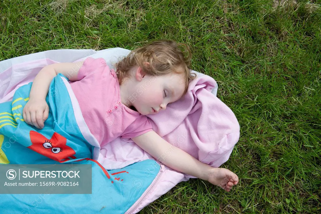 Little girl napping outdoors