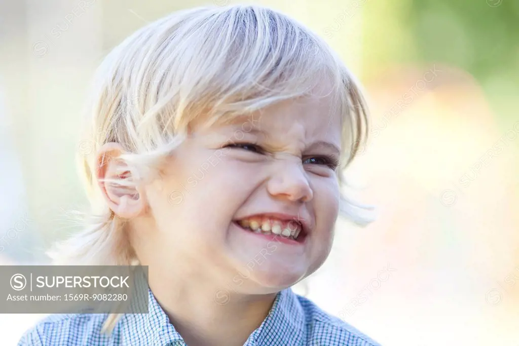 Little boy making face