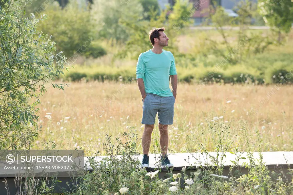 Man pausing to enjoy view on countryside walk