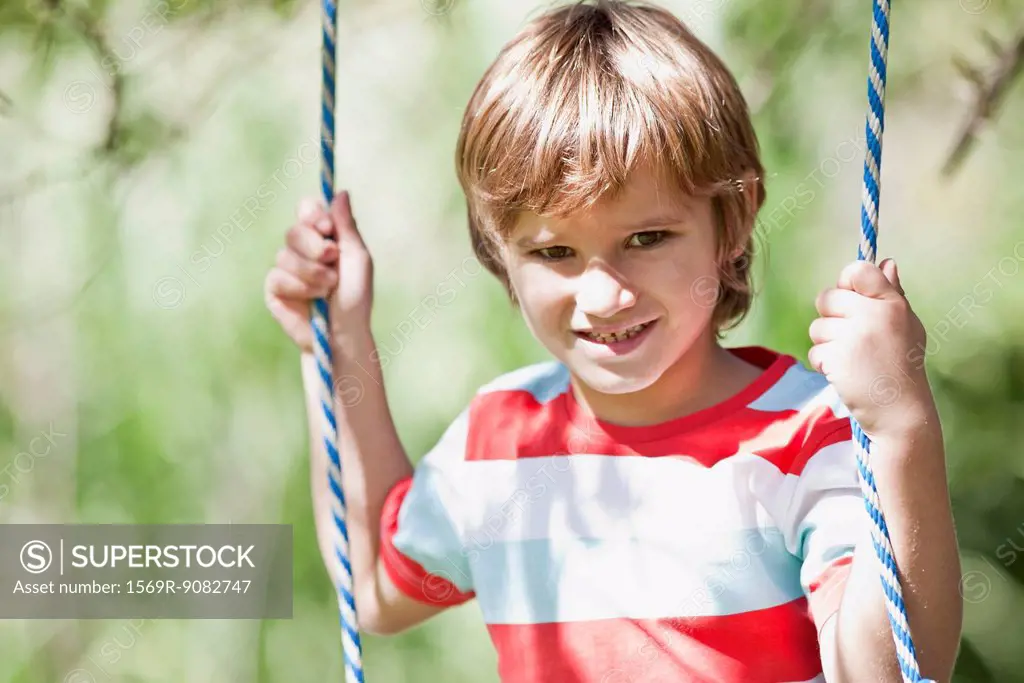 Boy on swing, portrait