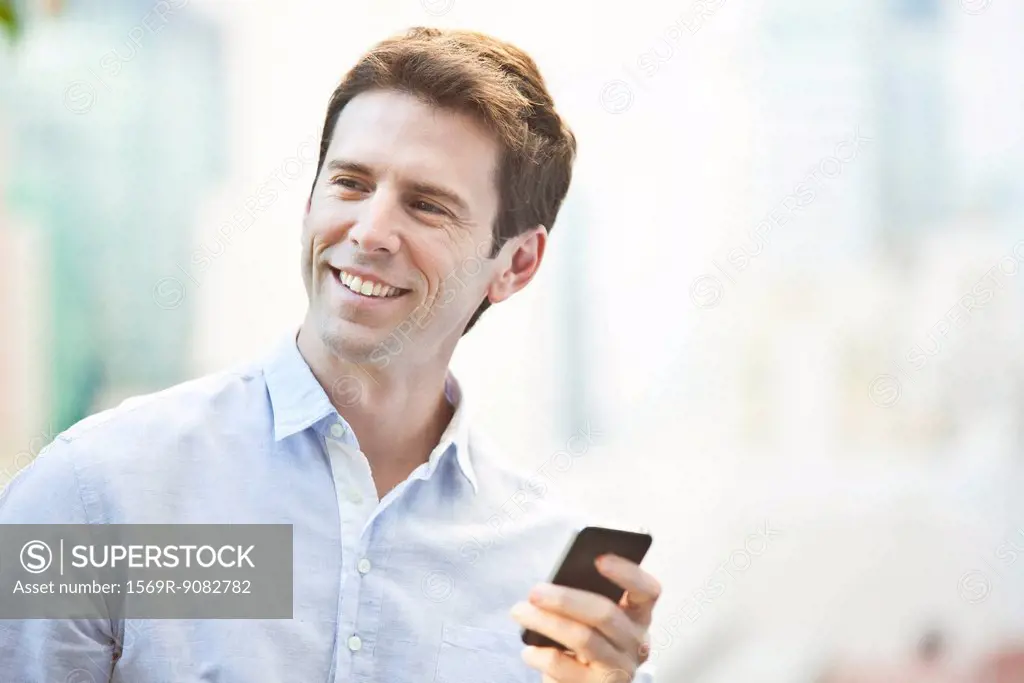 Mid-adult man using cell phone