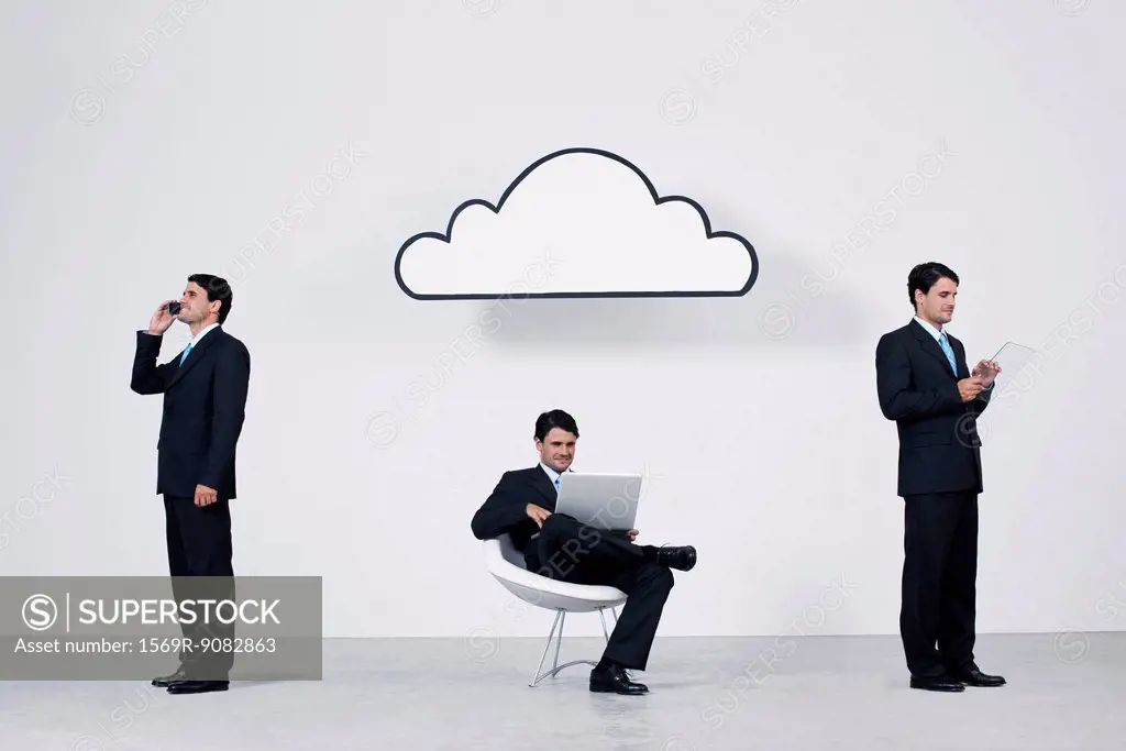 Businessmen using wireless devices with cloud computing network