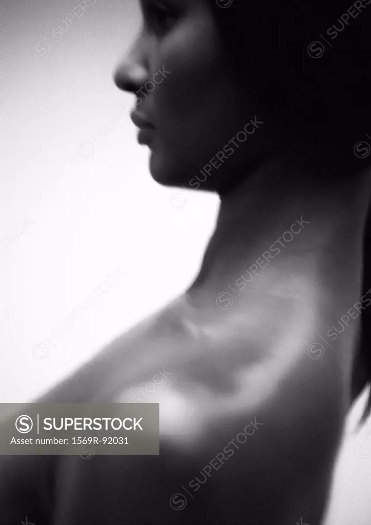 Woman´s face and shoulder, side view, close-up, B&W