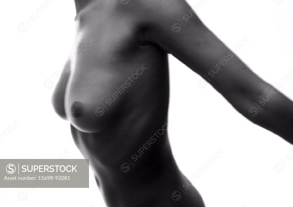 Woman´s bare chest with arms back, side view, B&W