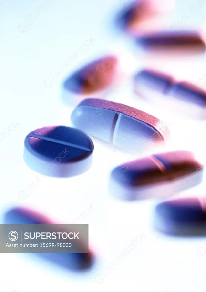 A variety of medicine tablets, close-up, blurred