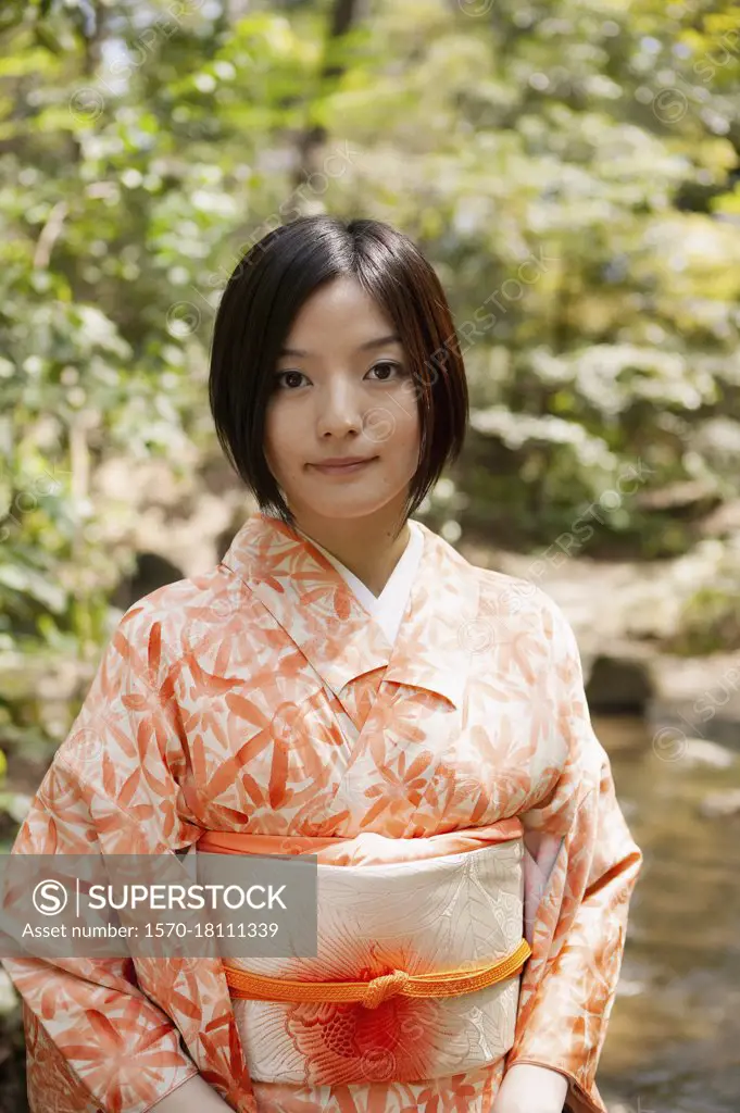 Portrait beautiful young woman in orange kimono