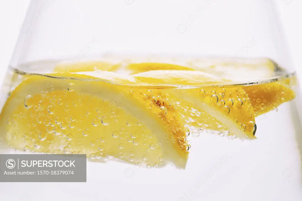 Extreme close up lemon slices in sparkling water