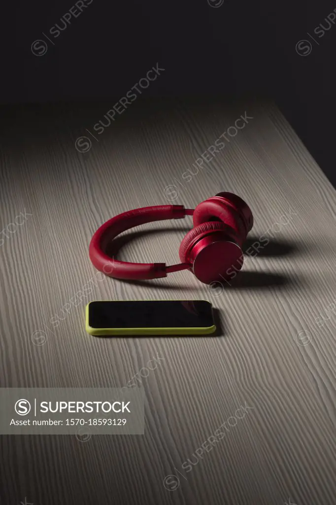 Headphones and smart phone on table