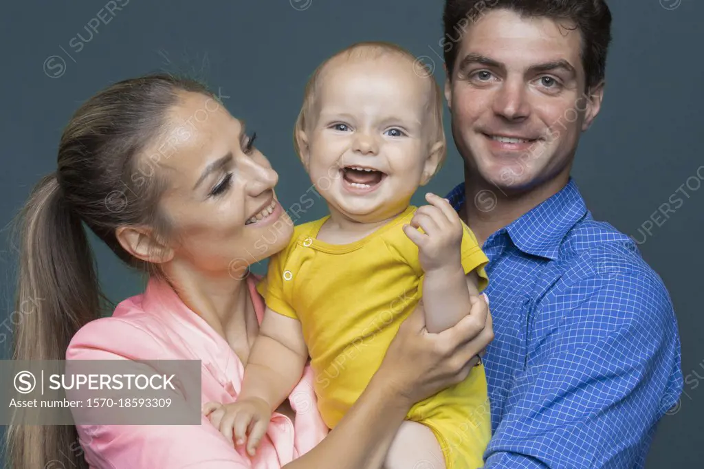 Portrait happy baby boy and parents