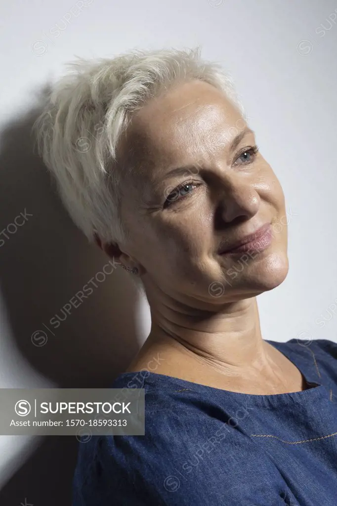 Portrait beautiful mature woman with short hair smiling
