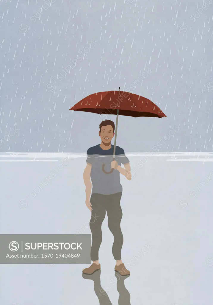 Portrait smiling man with umbrella standing in rain and flood rising water