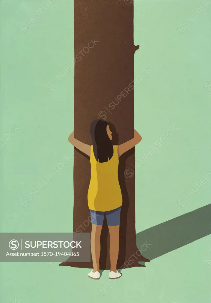 Environmentalist woman hugging tree trunk