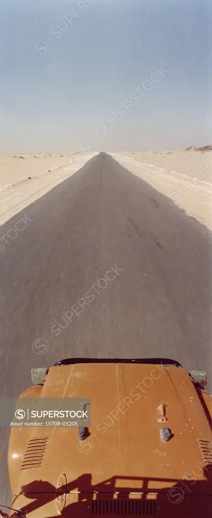 Off-road vehicle on desert road, Sahara desert, Egypt
