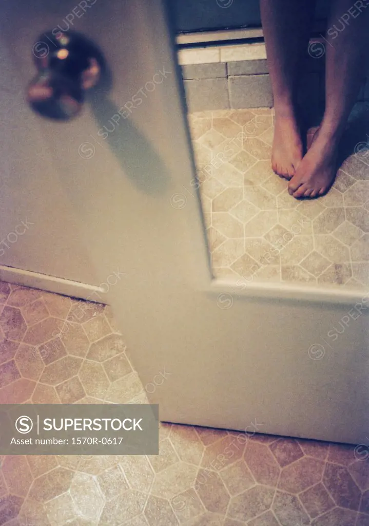 Woman's feet in a bathroom