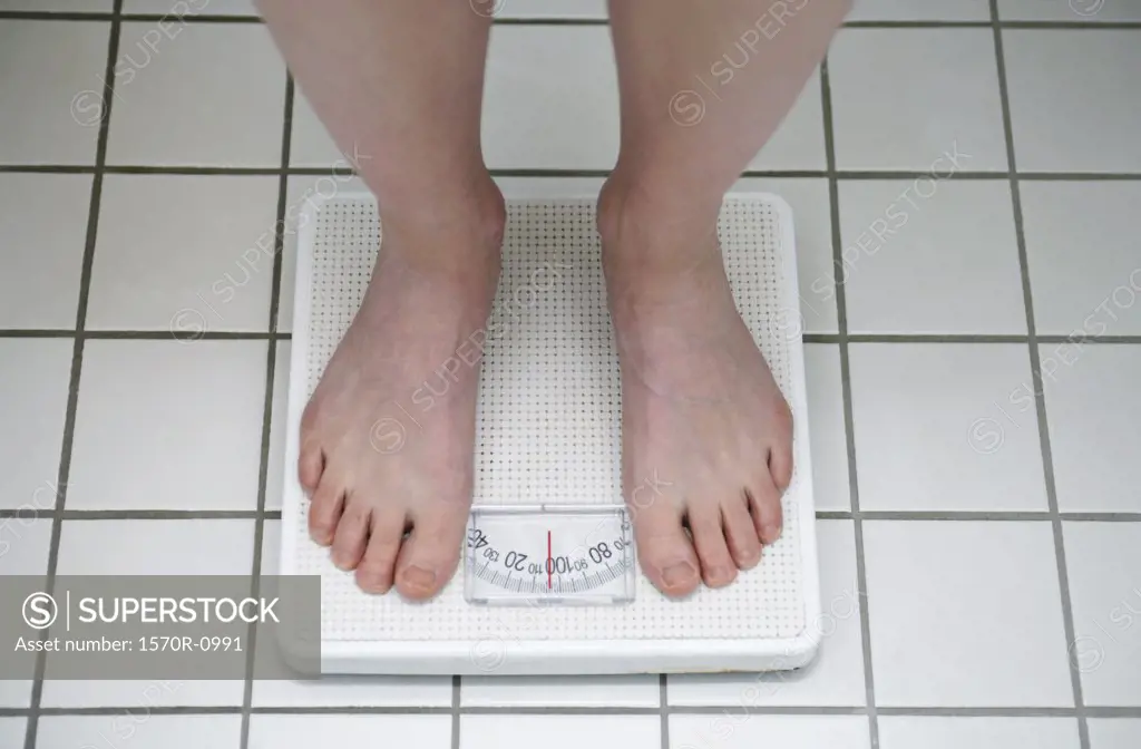 Woman standing on scale