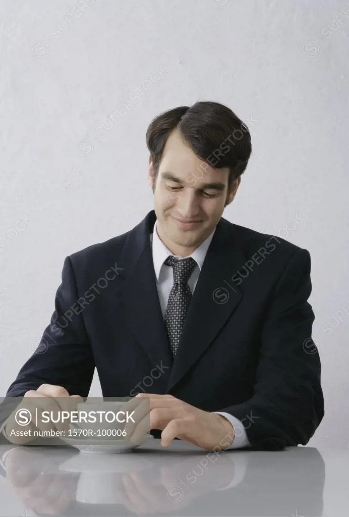 Businessman sitting with coffee cup