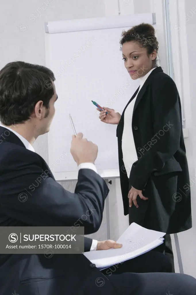 Businessman and businesswoman in meeting