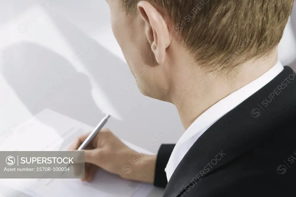 Businessman holding a pen 