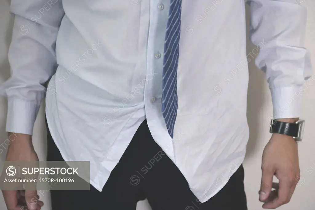 Man wearing wrinkled shirt and tie