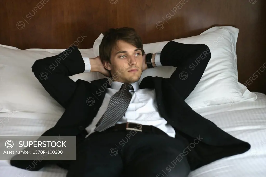 Man in suit lying down